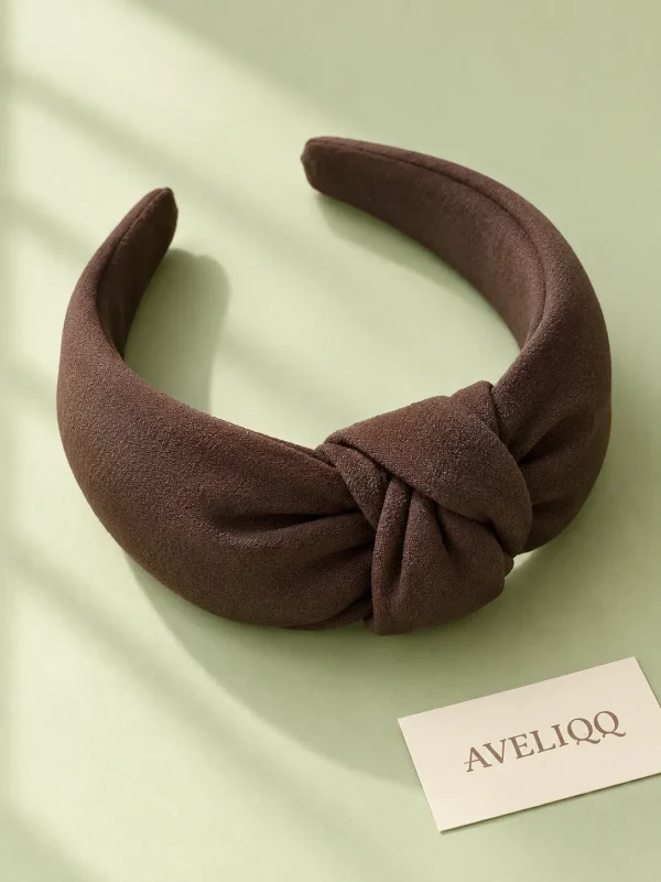 Doorframe Knot Headband on a plain coloured background