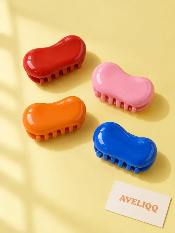Glossy Bean Claw Set on a plain coloured background