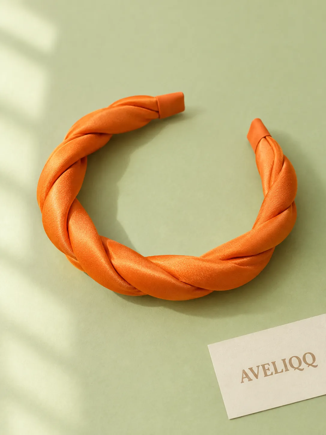 Tangerine Twist Headband on a plain coloured background